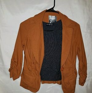 Orange-brown blazer.